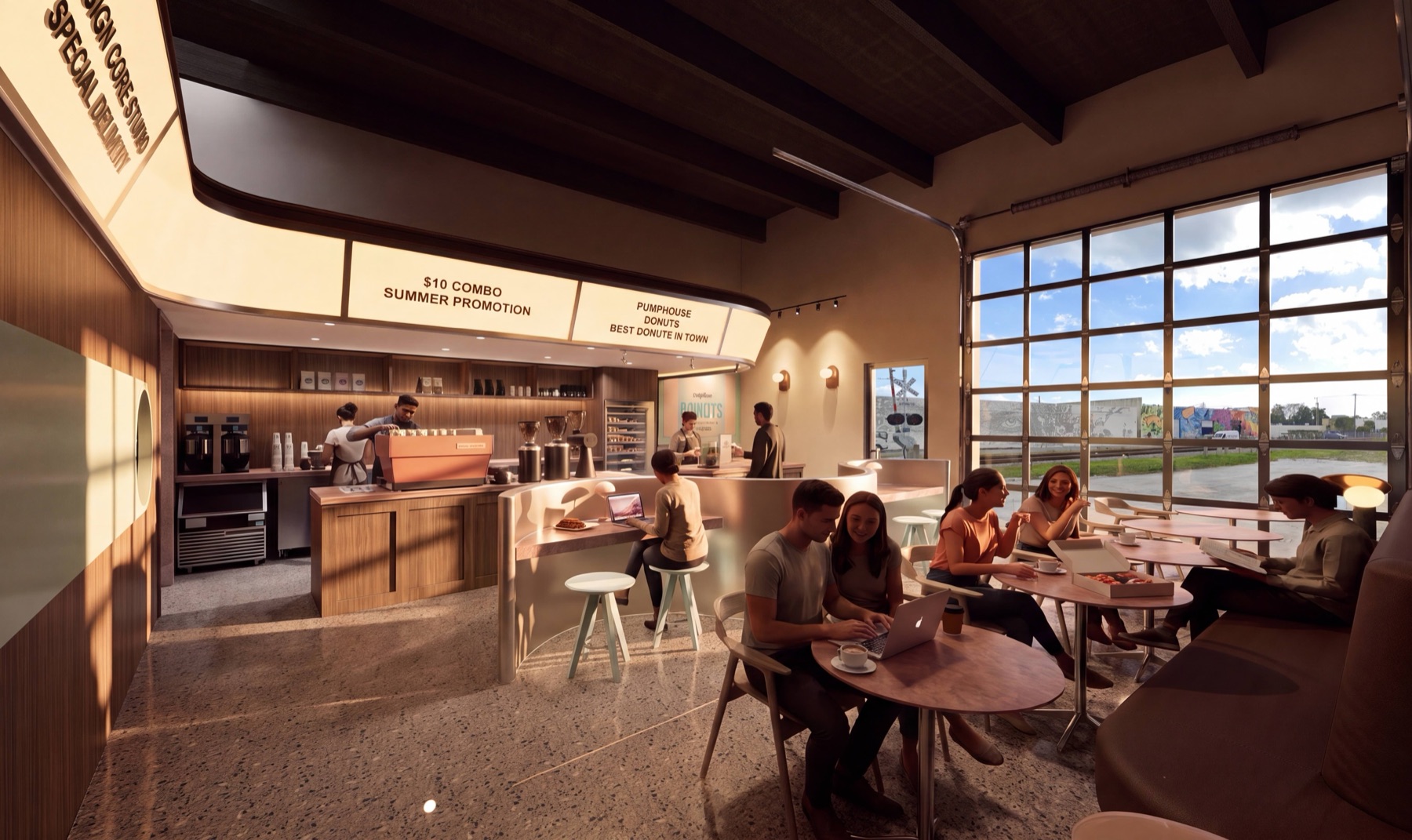 Pumphouse café interior with an espresso bar, donut case and sunlit roll-up windows